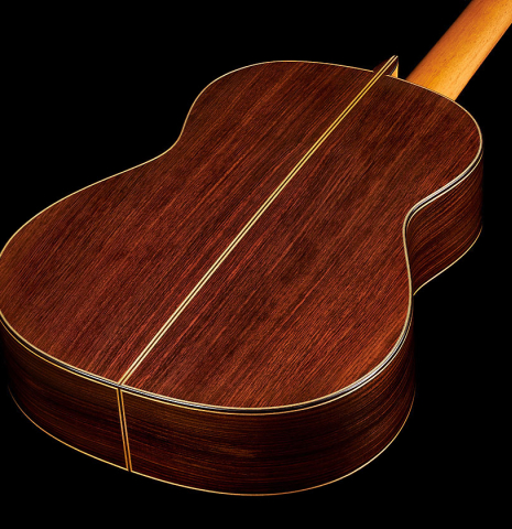 The back and sides at the foot of a 2023 Francisco Jimenez classical guitar made of cedar and Indian rosewood