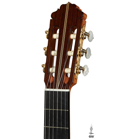 The headstock of a 2023 Francisco Jimenez classical guitar made of cedar and Indian rosewood