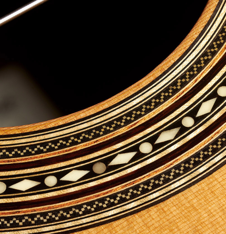Detail of the rosette of a 2023 Francisco Jimenez classical guitar made of cedar and Indian rosewood