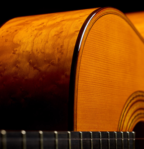 Side-view from the fingerboard of a 2025 Francisco Jimenez "Torres" classical guitar made of spruce and maple