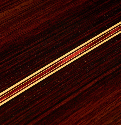 The close-up of the back of a 2022 So Kimishima “Stella” classical guitar made with cedar and Indian rosewood