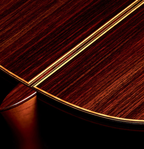 The heel and back of a 2022 So Kimishima “Stella” classical guitar made with cedar and Indian rosewood