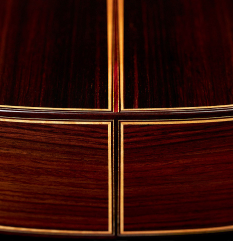 The back and sides of a 2022 So Kimishima “Stella” classical guitar made with cedar and Indian rosewood