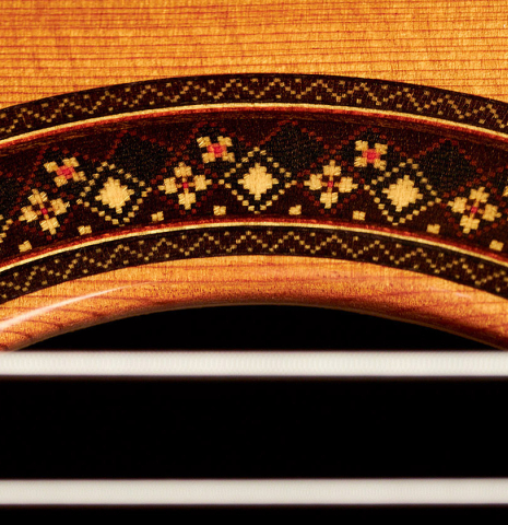 The close-up of a rosette of a 2022 So Kimishima “Stella” classical guitar made with cedar and Indian rosewood