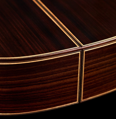 The foot and back of a 2023 So Kimishima “Stella” classical guitar made with cedar and Indian rosewood