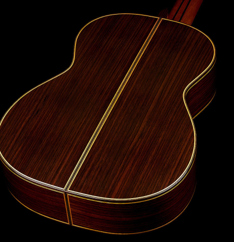 The back and sides of a 2023 So Kimishima “Stella” classical guitar made with cedar and Indian rosewood