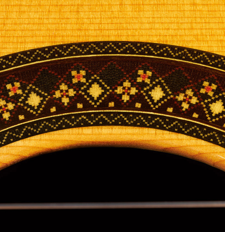 Detail of the rosette of a 2023 So Kimishima “Stella” classical guitar made with cedar and Indian rosewood
