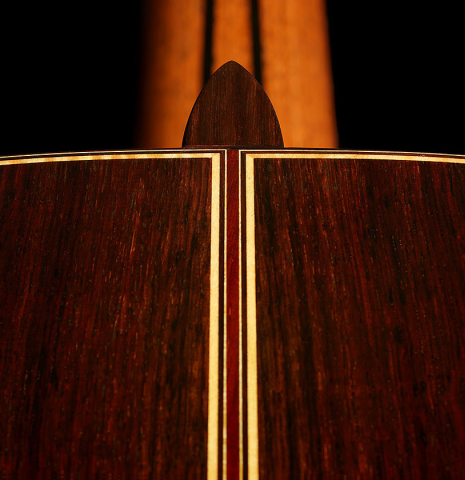 The heel, back center seam, binding and purfling of a 2025 So Kimishima “Stella” classical guitar made of cedar and Indian rosewood