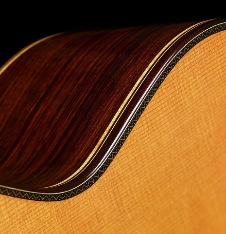 The soundboard binding and purfling of a 2025 So Kimishima “Stella” classical guitar made of cedar and Indian rosewood