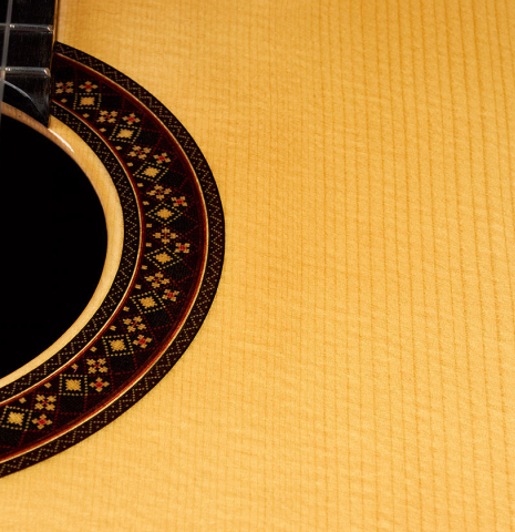 The rosette and soundboard of a 2022 So Kimishima “Stella” classical guitar made with spruce and Indian rosewood