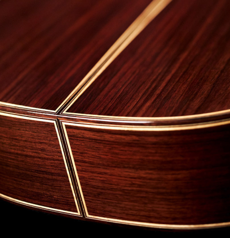 The foot, back and sides of a 2023 So Kimishima “Stella” classical guitar made with spruce and Indian rosewood