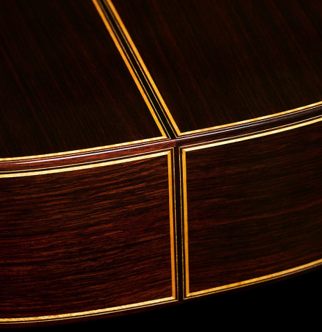 Back and sides at the foot of a 2023 So Kimishima “Stella” classical guitar made with spruce and Indian rosewood