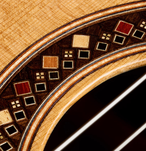 Closeup detail of the rosette of a 2026 So Kimishima “Sol” classical guitar made of cedar and African rosewood