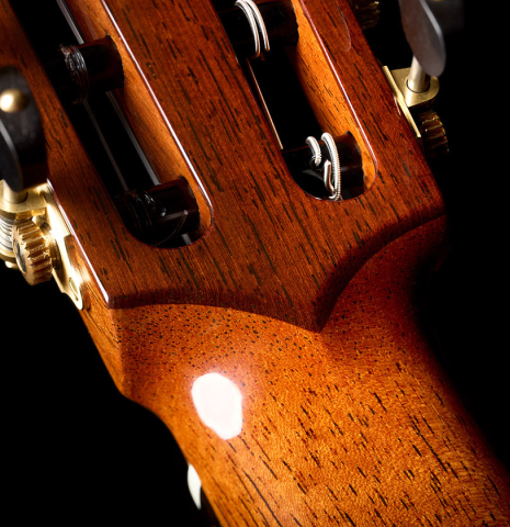 The back of the headstock veneer of a 2026 So Kimishima “Sol” classical guitar made of cedar and African rosewood