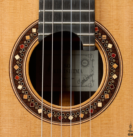 The rosette of a 2026 So Kimishima “Sol” classical guitar made of cedar and African rosewood