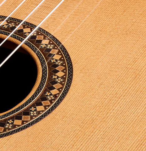 The soundboard and rosette of a 2026 So Kimishima “Luna” classical guitar made of cedar and African rosewood