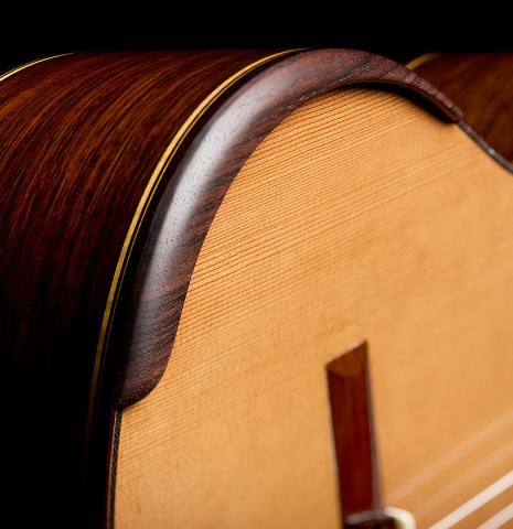 The top and armrest of a 2026 So Kimishima “Luna” classical guitar made of cedar and African rosewood