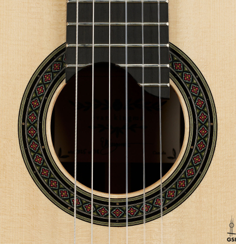 The rosette of a 2025 Evan Kingma classical guitar made of spruce and ziricote