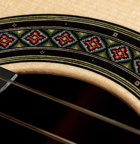 Closeup detail of the rosette of a 2025 Evan Kingma classical guitar made of spruce and ziricote