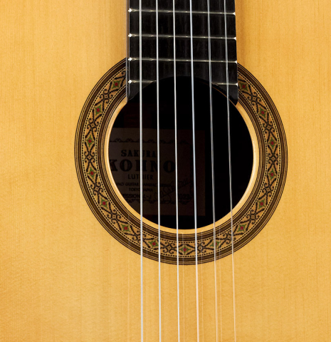 The front and rosette of a 2023 Sakurai-Kohno "Professional-J" classical guitar made with spruce and CSA rosewood.