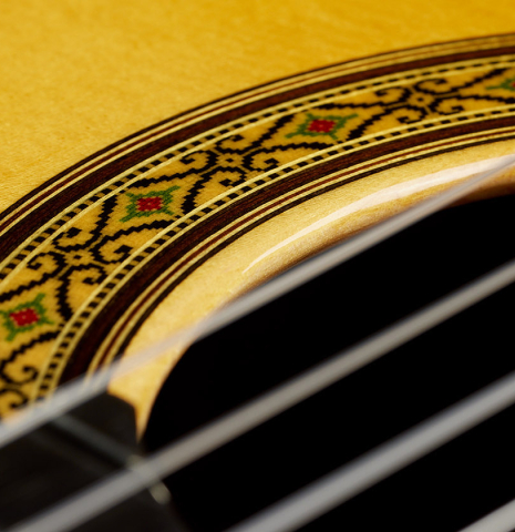 Close-up detail of the rosette of a 2024 Sakurai-Kohno "Professional-J" classical guitar made with spruce and African rosewood.