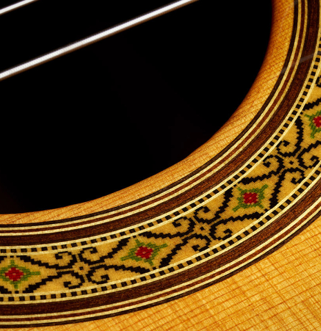 The top and rosette detail of a 2025 Sakurai-Kohno "Professional-J" classical guitar made of cedar and African rosewood