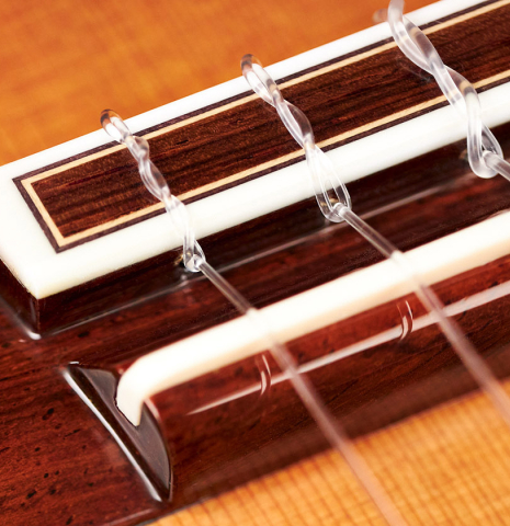 The bridge and saddle of a 2004 Sakurai-Kohno "Professional-J" classical guitar made of cedar and CSA rosewood