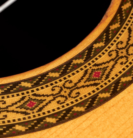 A close-up of the rosette of a 1982 Masaru Kohno &quot;Concert&quot; classical guitar made of spruce and Indian rosewood