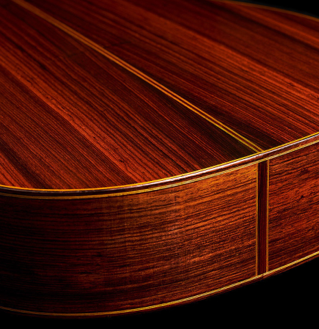 The back and sides at the foot of a 1964 Masaru Kohno "4" classical guitar made of spruce and Indian rosewood