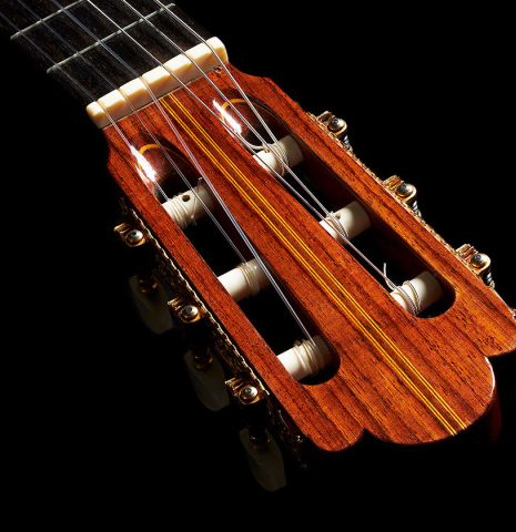 The headstock and tuning machines of a 1964 Masaru Kohno "4" classical guitar made of spruce and Indian rosewood