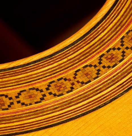 Close-up detail of the rosette of a 1964 Masaru Kohno "4" classical guitar made of spruce and Indian rosewood