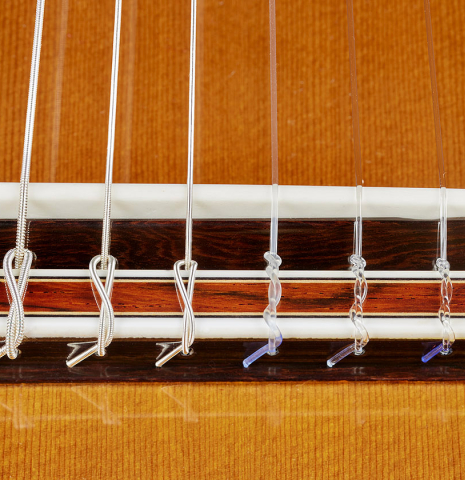 The bridge, tie-block and saddle of a 2024 Sakurai-Kohno "Professional-J 630" classical guitar made of cedar and African rosewood