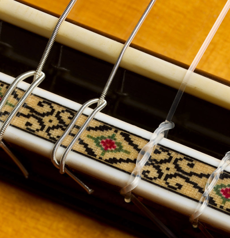 The bridge, tie-block and saddle of a 1981 Masaru Kohno "30" classical guitar made of spruce and CSA rosewood