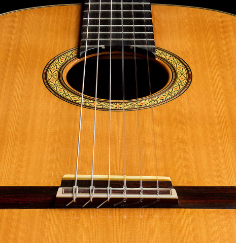 The soundboard and bridge of a 2006 Sakurai-Kohno "Professional-J" classical guitar made of cedar and CSA rosewood