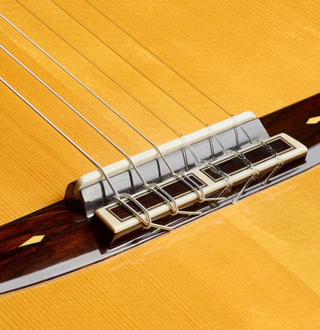 The bridge, tie-block and saddle of a 2003 Sakurai-Kohno "Maestro" classical guitar (ex John Dearman) made of spruce and CSA rosewood