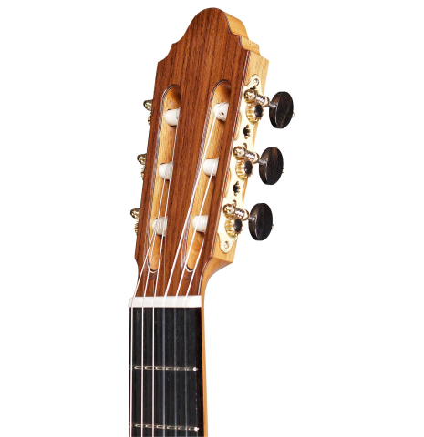The headstock and tuners of a 2015 Zoran Kuvac classical guitar made with cedar and African rosewood