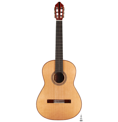 The front of a 2023 Zoran Kuvac classical guitar made of cedar and cocobolo on a white background.