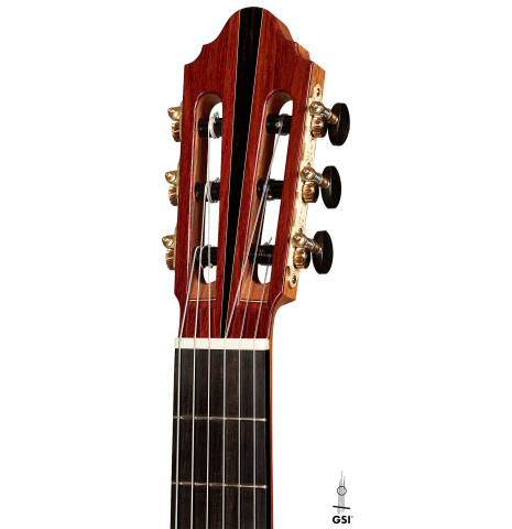 The headstock of a 2023 Zoran Kuvac classical guitar made of cedar and cocobolo on a white background.