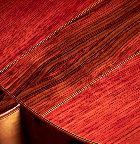 Closeup of the heel and back of a 2023 Zoran Kuvac classical guitar made of cedar and cocobolo.