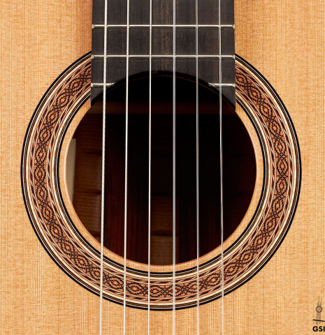 The rosette of a 2023 Zoran Kuvac classical guitar made of cedar and cocobolo.