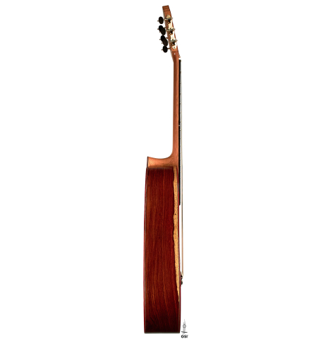 The side of a 2023 Zoran Kuvac classical guitar made of cedar and cocobolo on a white background.