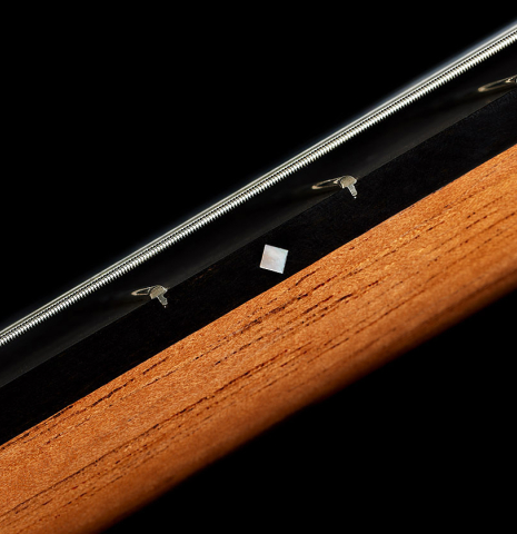 The neck, fingerboard and fret dot of a 2024 Zoran Kuvac "Double Top" classical guitar made of spruce and CSA rosewood