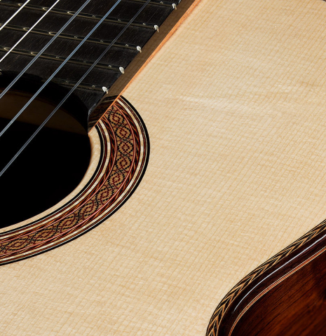 The soundboard and rosette of a 2024 Zoran Kuvac "Double Top" classical guitar made of spruce and CSA rosewood