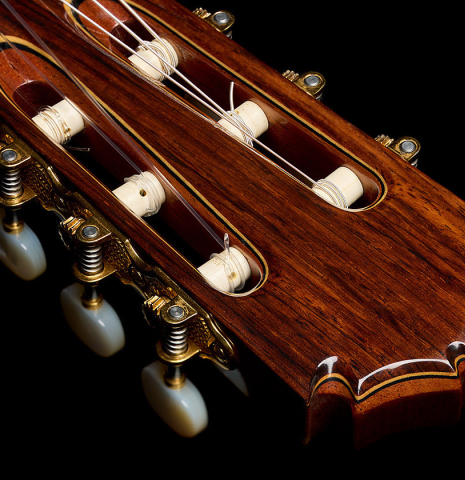 The headstock and tuning machines of a 2004 Bert Kwakkel "Merula 640" classical guitar made of spruce and CSA rosewood