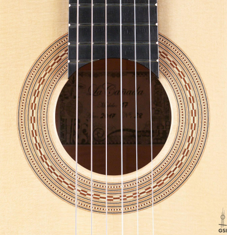 The rosette of a La Cañada "Model 17" classical guitar made of spruce and maple