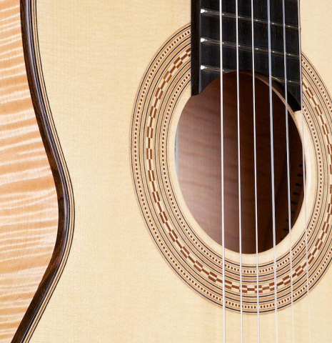 The soundboard and rosette of a La Cañada "Model 17" classical guitar made of spruce and maple