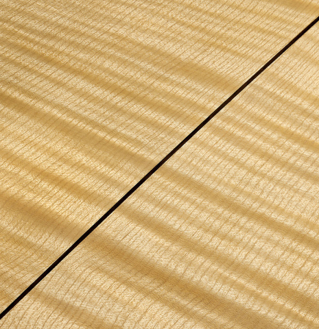 The back center seam of a La Cañada "Model 17" classical guitar made of spruce and maple