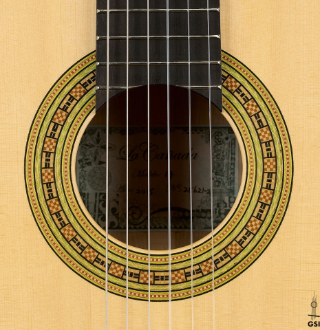 The rosette of a La Cañada "Model 17" classical guitar made of spruce and maple