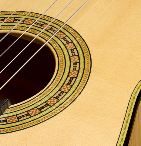 The top and rosette of a La Cañada "Model 17" classical guitar made of spruce and maple