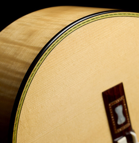 The soundboard, bridge and side of a La Cañada "Model 17" classical guitar made of spruce and maple